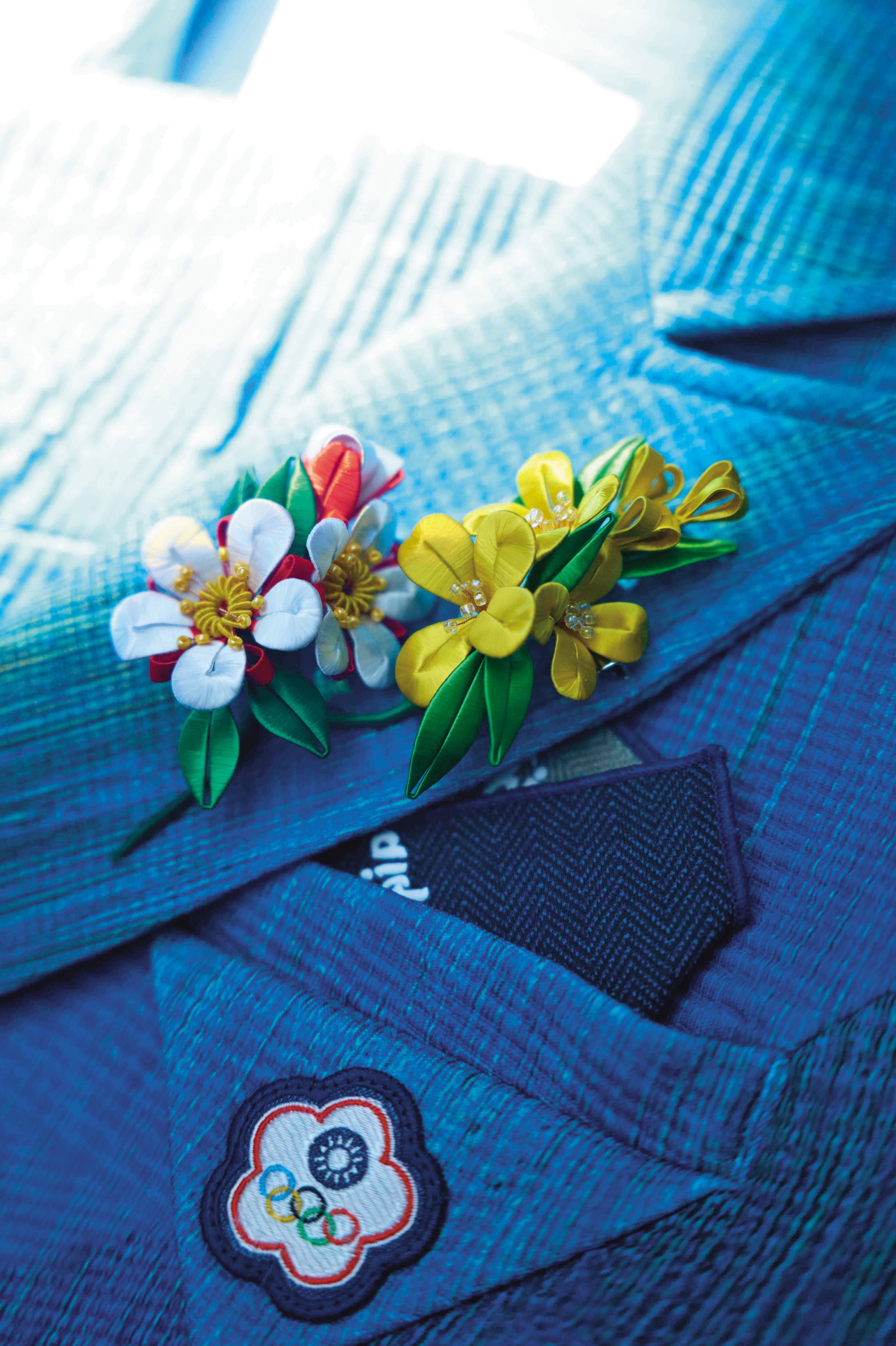 「台灣國花」梅花配上象徵豐收之意的油菜花，為中華健兒加油打氣。（JUST IN XX提供）